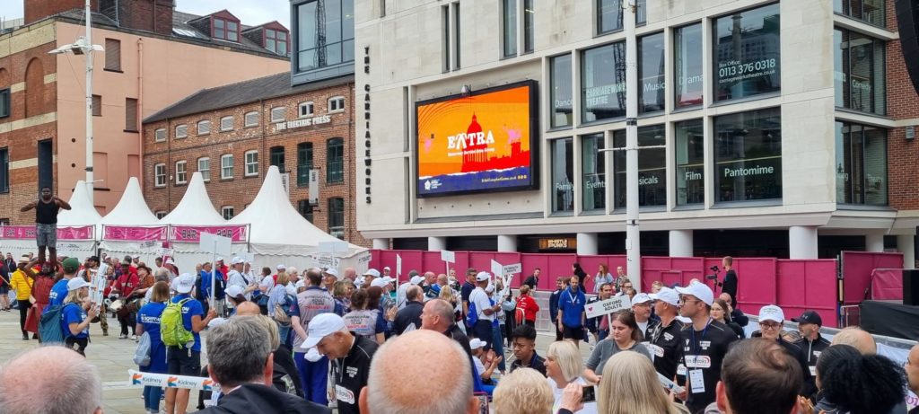 A photo of people outside celebrating the British transport games